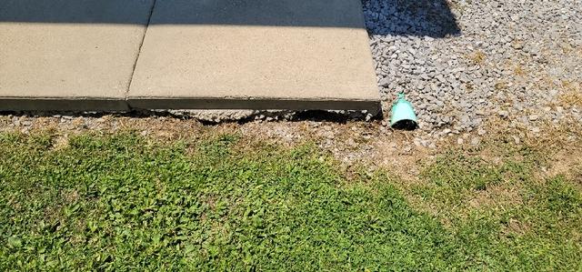 sidewalk erosion due to ground settlement and poor drainage before Poly Level Injection