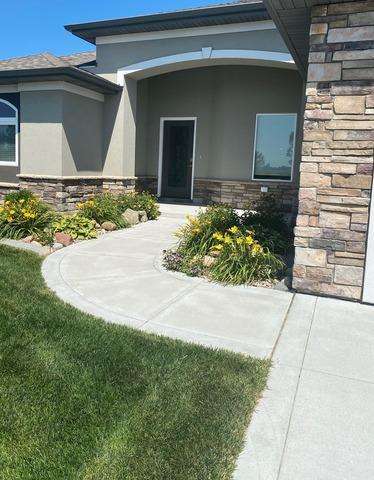 This "before" photo shows how unsealed control joints were allowing water to run under the concrete slabs which caused voids and settling.