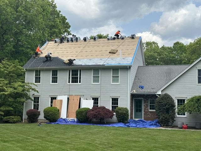 Putting up the roof.