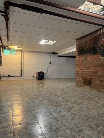 Basement After Renovations with SaniDry Sedona Dehumidifier Pictured