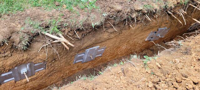 A close up of the Geo Locks anchoring the outside soil