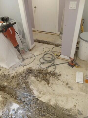 Jack Hammers are used to open the floor