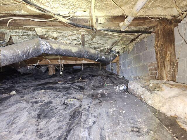 A crawlspace showing signs of deterioration