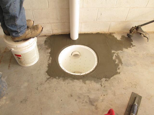 The SuperSump is being cemented in place and installation is almost finished!