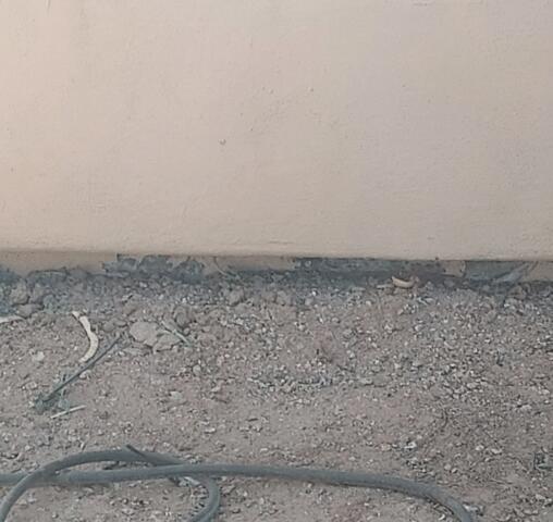 Signs of Corrosion in a Stem Wall: Flaking Paint in Goodyear, AZ