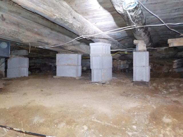 This crawlspace had lots of moisture seeping into the home.