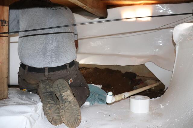 Sump pump installation and discharge line