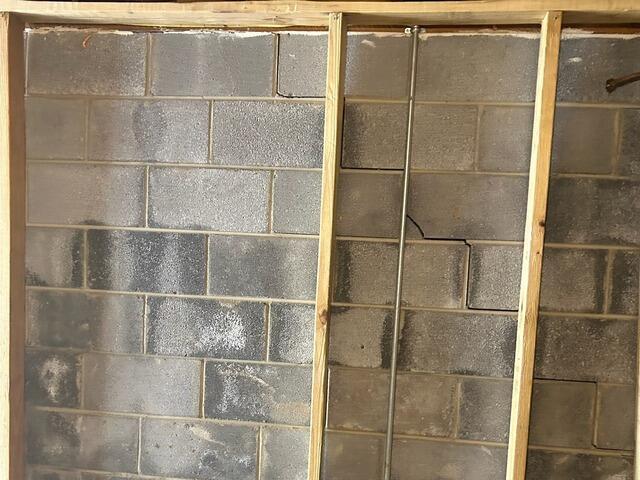 A close-up view of a stair step crack.