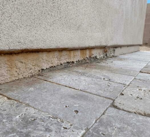 Signs of Corrosion in a Stem Wall: Flaking Paint in Gilbert, AZ