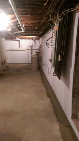 The next step to waterproofing the basement is to install the WaterGuard perimeter drain. It catches any water that leaks through the wall-floor joint, as well as collecting water from the BrightWall panels. 