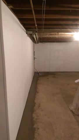 The Brightwall we installed in this home, which is 100% waterproof and washable, creates a vapor barrier on the basement walls to stop humidity and moisture from seeping into the room. It can also direct water seepage into your perimeter drain, to be pumped out of the basement.