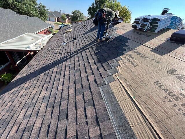 Laying the shingles in place.