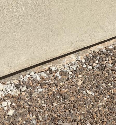 Signs of Corrosion in a Stem Wall: Flaking Paint in Carefree, AZ