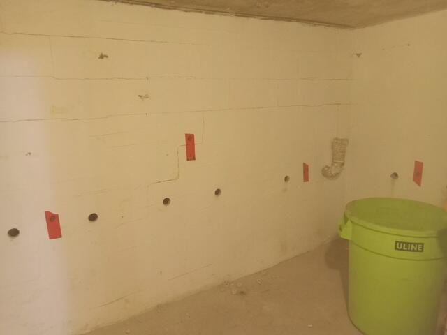 Holes drilled for grout