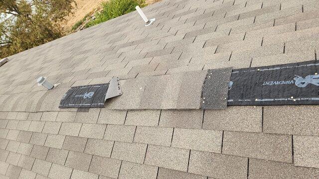 Shingles being beat with the wind.