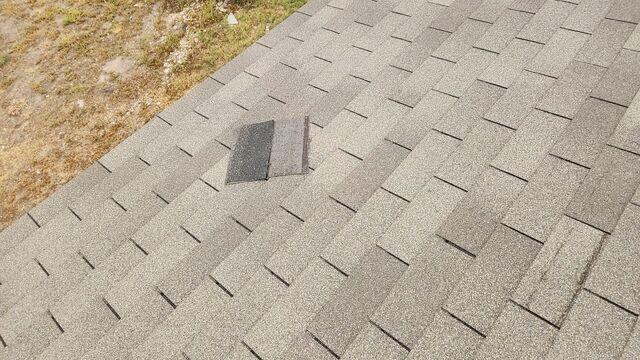 Shingles falling  off roof.
