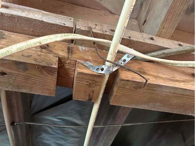 A close-up of the weak point in the wooden beam.