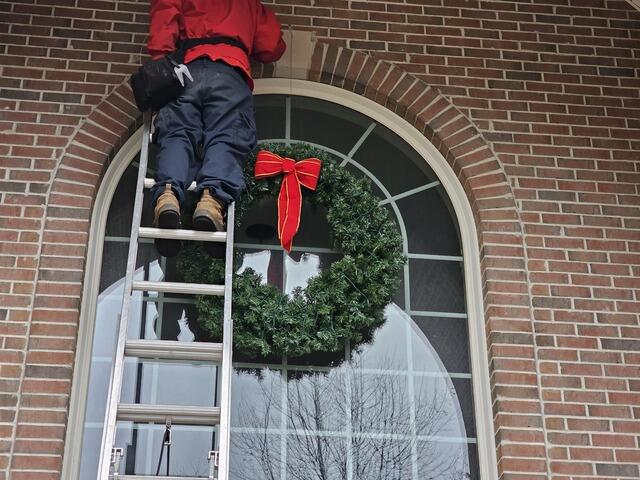 Hanging up the Wreath