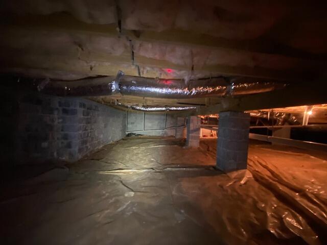 The crawlspace appeared as it did before our crew started working on it.
