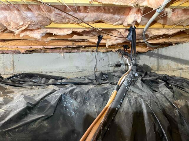 Before - Old Fiberglass and Ruffled up Vapor Barrier