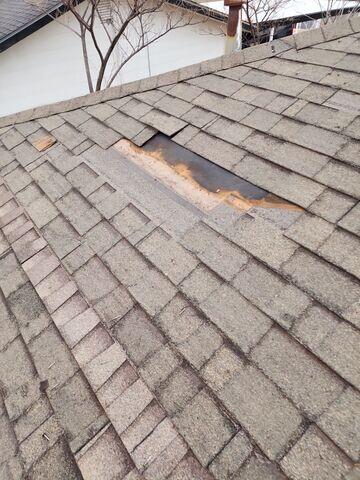 Removing old existing shingles.