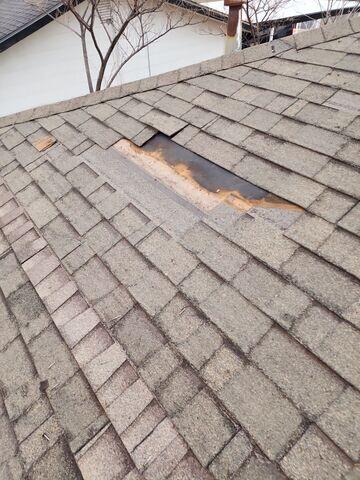 Removing old existing shingles.