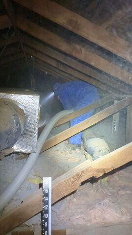 Crew Members blowing in the insulation