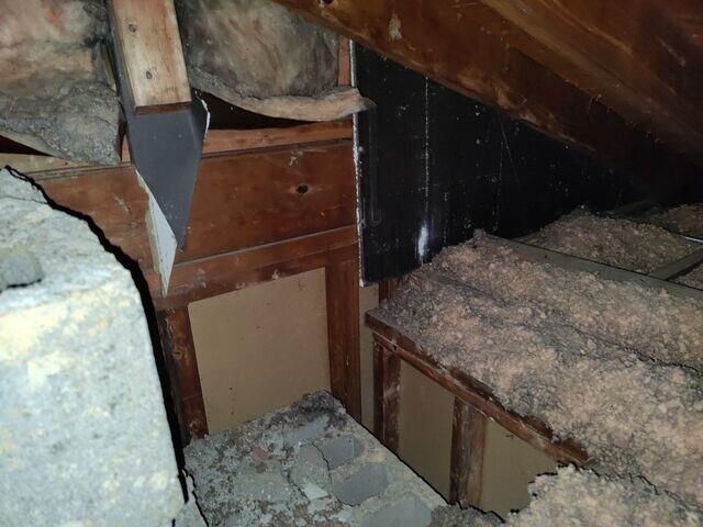 Funky Attic area around masonry chimney