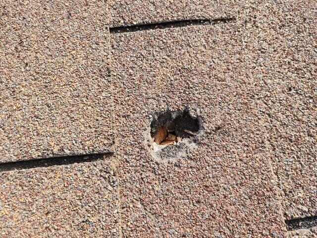 Damaged shingles down to the surface.