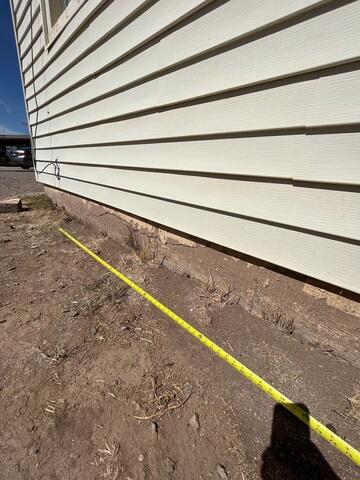 Signs of Stem Wall Failure: Flaking Paint and Cracks in Florence, Arizona