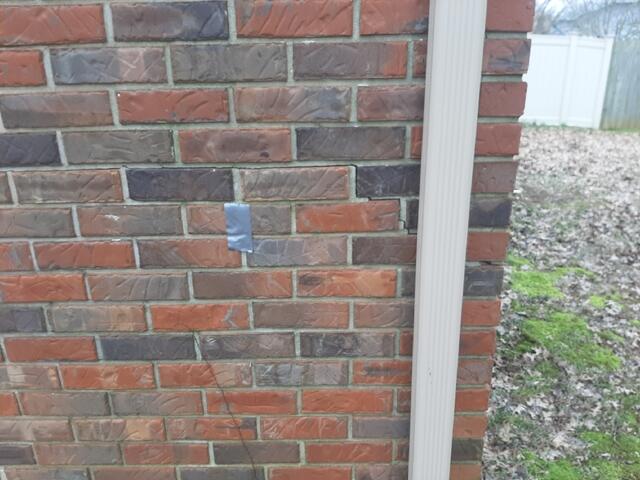 Exterior Cracks in Brick on Side of Home