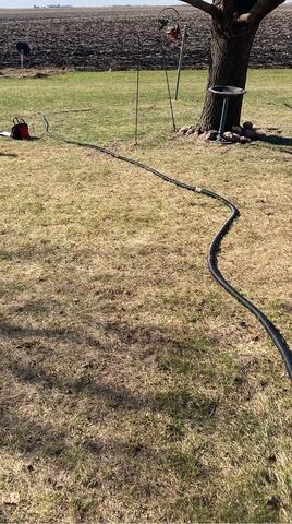 Discharge Hose Across the Lawn