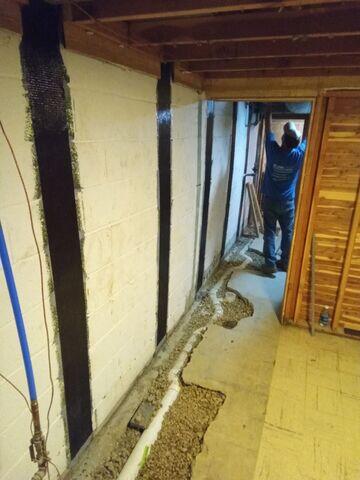 Interior Drainage System and CarbonArmor® Wall Reinforcing System Installed After Helical Piers