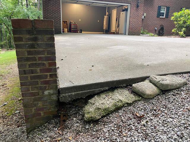 A close-up of the soil underneath the cement slab.