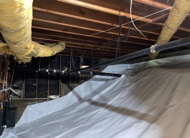 Crawlspace encapsulation creates moisutre barrier in Benicia, CA, home crawlspace
