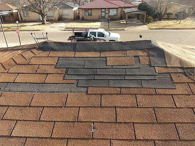 Miss matched shingles and shingle damage.