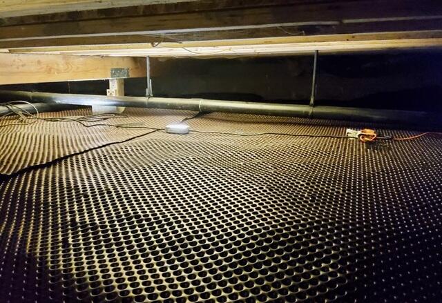 Water drainage matting installed in Sea Ranch, CA, home crawlspace