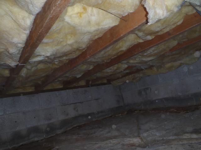 <p>The humidity in the crawl space has caused the fiberglass insulation to sag from the sub-floor, making the insulation useless.&nbsp;</p>