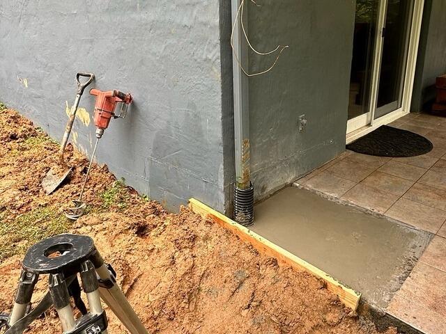 After our crew installed two Helical Piers, the corner of the house was stabilized.