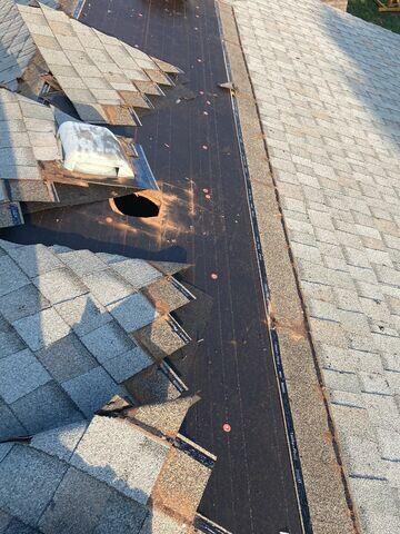 Removal of the low profile vent and shingles.