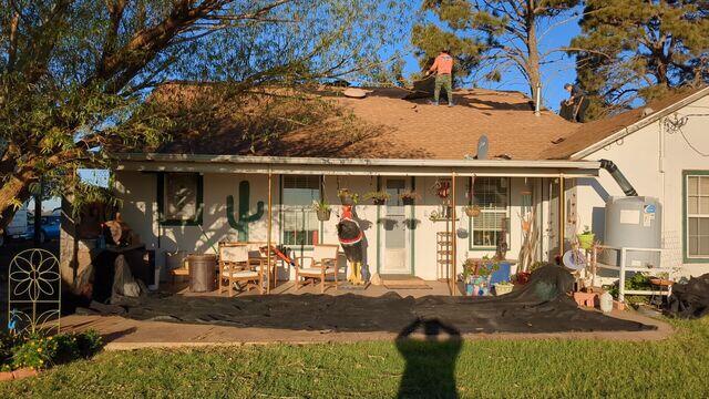 Crew members in the tear down process.