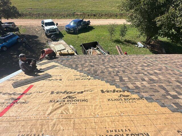 Crews half way done with the roof.