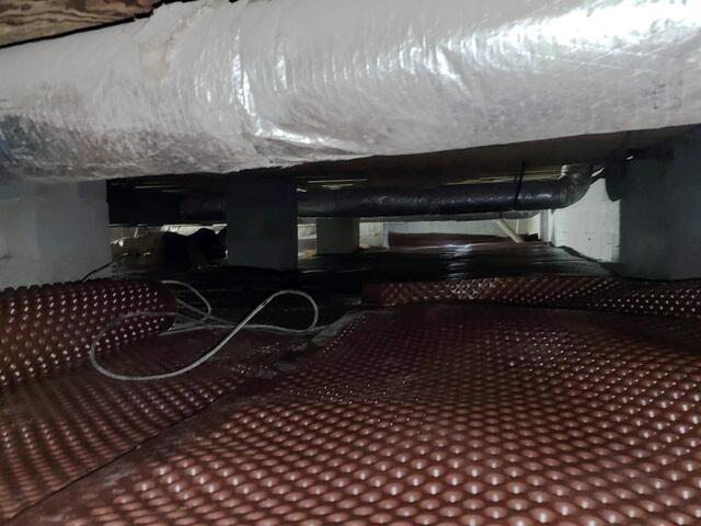 A work in progress picture of the crawlspace being encapsulated.