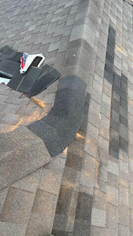 Repair to the ridge shingles.