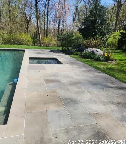 Pool patio with in ground hot tub