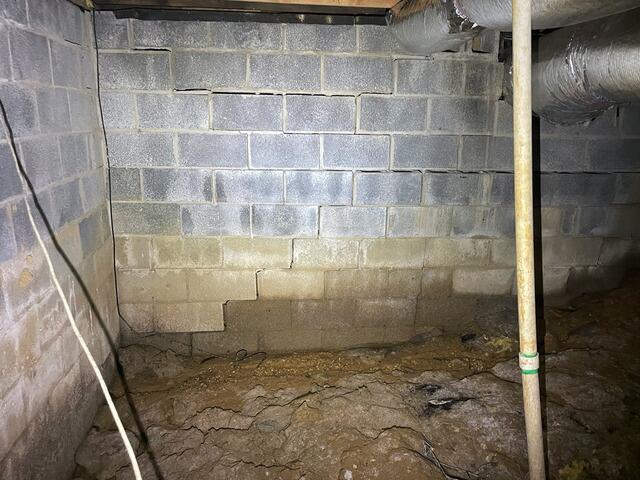 This wall presented two large stair-step cracks.