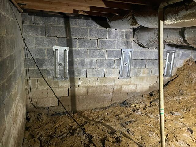 The same wall featured three wall anchors.