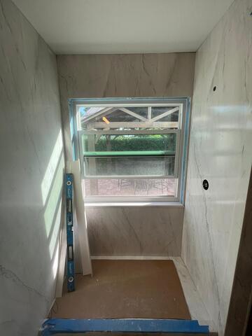 From Tub to Shower: Walls Installed, Transformation Underway