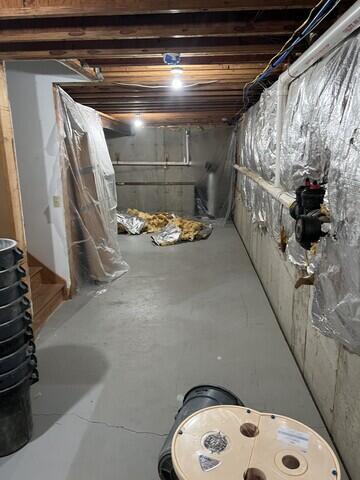 Cracks in floor and crumbling walls - Before