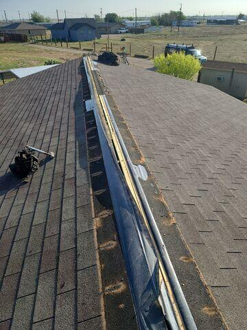 Removing all old shingles on ridge.